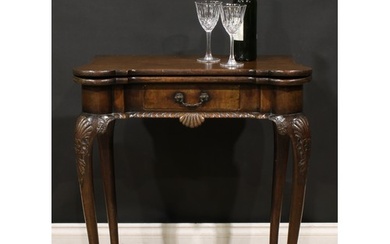 A George II Revival Irish mahogany card table, hinged hipped...