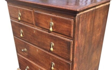 A Georgian oak chest of drawers, the rectangular moulded...