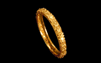 A Gold Alloy Repoussé Bracelet Southeast Asia