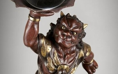 A LARGE BRONZE FIGURE OF AN ONI WITH CRYSTAL BALL