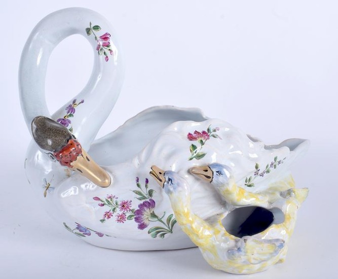 A LATE 19TH CENTURY FRENCH FAIENCE GLAZED SWAN PLANTER