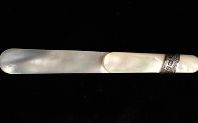 A Late Victorian Mother of Pearl Clip/Book Marker bound with a silver strap engraved with scrolling