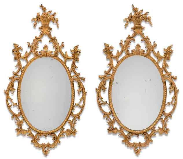 A PAIR OF GEORGE III GILT CARTON PIERRE OVAL MIRRORS