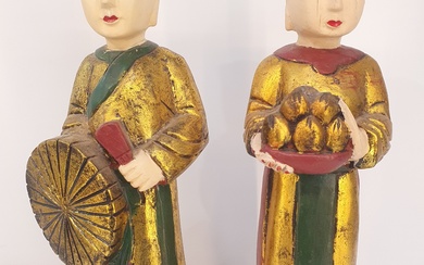 A PAIR OF VIETNAMESE CARVED GILTWOOD AND POLYCHROME FIGURES