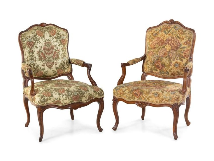 A Pair of Louis XV Style Carved Walnut Fauteuils