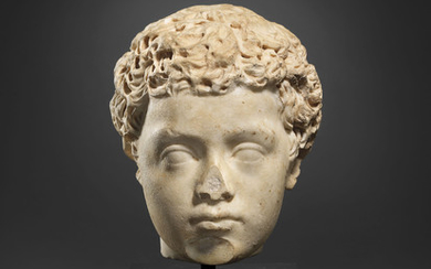 A ROMAN MARBLE PORTRAIT HEAD OF A BOY, ANTONINE PERIOD, CIRCA LATE 2ND CENTURY A.D.