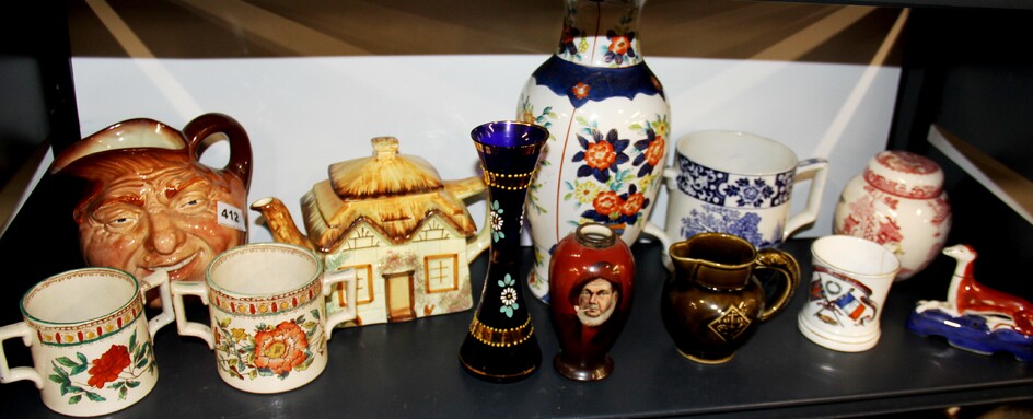 A Royal Doulton character jug and other china items.