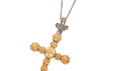 A SILVER CITRINE CRUCIFORM PENDANT NECKLACE; 40 x 30mm cross set with an oval and round cut citrines on a marcasite set bail and sil...