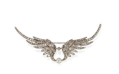 A SILVER-TOPPED GOLD AND DIAMOND WING BROOCH