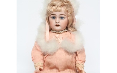 A Simon & Halbig bisque socket head doll, with blue glass fi...