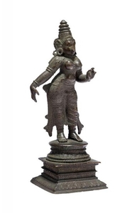 A South Indian bronze triad of Vishnu...