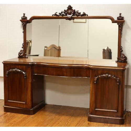 A VICTORIAN MAHOGANY MIRRORED BACK SIDEBOARD of serpentine o...