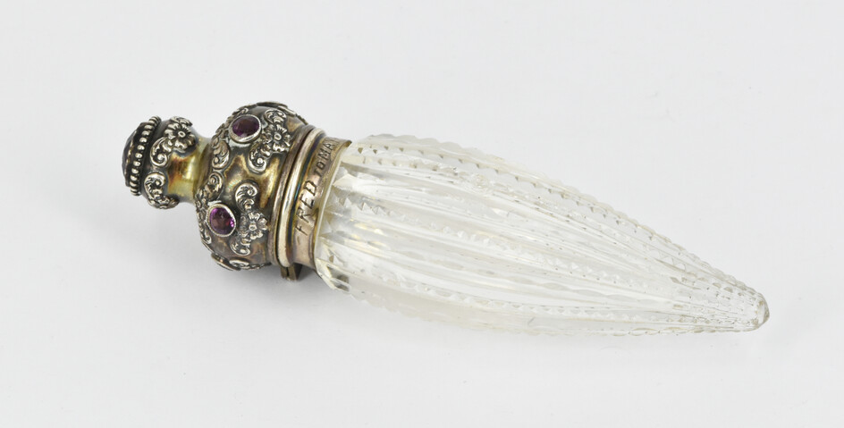 A VICTORIAN STERLING SILVER MOUNTED AND CUT GLASS SCENT BOTTLE