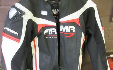 A black, white and red motorcycle jacket by ARMR-MOTO.Condition Report...