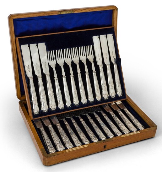 A boxed set of Edwardian silver fish eaters, London, 1902, Goldsmiths & Silversmiths Co., comprising twelve each fish forks and knives with King's pattern terminals, in original fitted wooden box