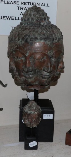 A bronze multiple face Buddha head and a similar smaller...
