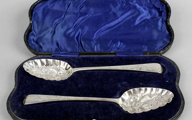 A cased pair of George III silver 'berry' spoons.