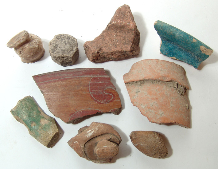 A collection of stone and pottery fragments