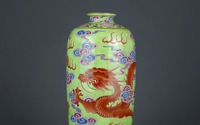 A delicate green field famille-rose iron red dragon vase