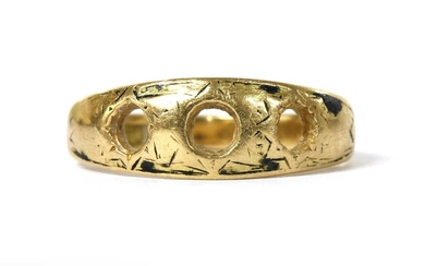 A gold three stone vacant ring mount