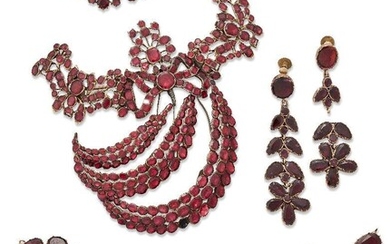 A group of antique garnet jewellery, including: an early 19th century foiled garnet aigrette, (some evidence of repair and adaptation) approximate length 8.5cm; and a group of various 19th century gold mounted foiled garnet fittings