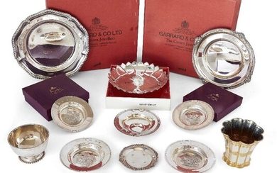 A group of silver comprising: two boxed silver plates, by Garrard & Co., Sheffield, c.1964 and 1972; both with gadrooned rims and presentation engraving, 20.4cm and 22.3cm dia.; a single-handled porringer by Garrard & Co., with applied flower motif...