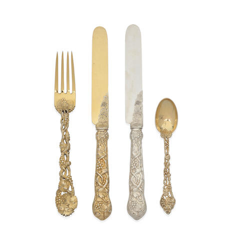 A group of silver-gilt and silver pierced vine pattern flatware