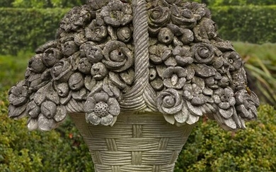 A large Continental sculpted limestone pier ornament modelled as a basket of flowers