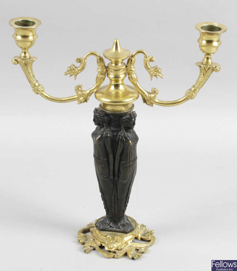 A late 19th century bronze and gilt bronze twin branch
