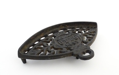 A late 19th / early 20thC Otto gas iron rest with stylised f...