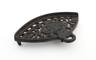 A late 19th / early 20thC Otto gas iron rest with stylised foliate detail, marked with patent no.