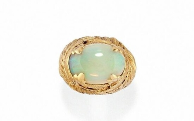 A low title gold ring with opal