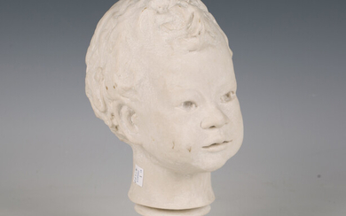 A modern reconstituted marble bust of a young boy, height 27cm.