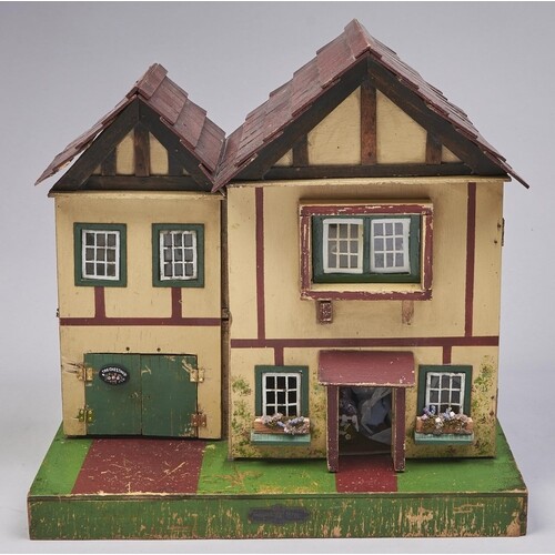 A painted wood twin gabled doll's house, second quarter 20th...