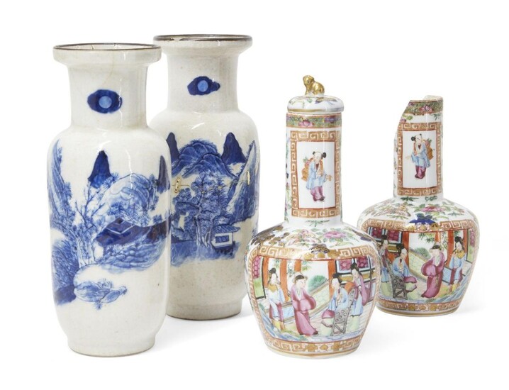A pair of Chinese Canton export porcelain famille rose vases, late 19th century, painted with scenes of seated figures within scroll-ends borders, the exteriors decorated with flowering lotus blossoms heightened with gilt, 21.5cm high, and a pair...