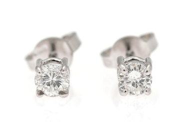 SOLD. A pair of diamond ear studs each set with a brilliant-cut diamond weighing a...