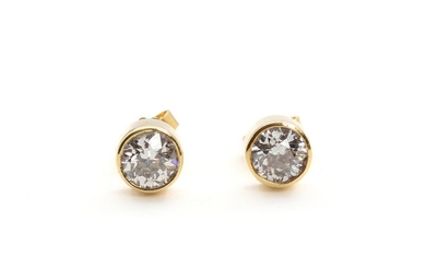 A pair of diamond earrings, each set with an old-cut diamond totalling app. 2.00 ct., mounted in 14k gold. Diam. 7.4 mm. 1994. (2)
