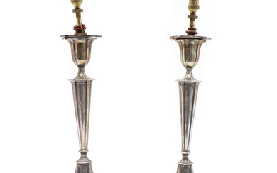 A pair of early 20th century silver candlesticks