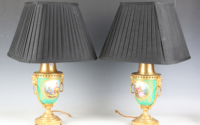 A pair of late 19th century French Sèvres style porcelain and ormolu mounted urns, converted to