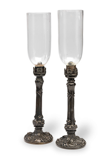 A pair of late 19th century bronze hurricane lamps