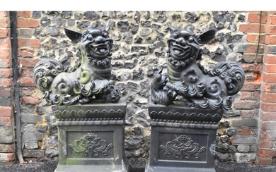 A pair of mid/late 20th century earthenware garden statues o...