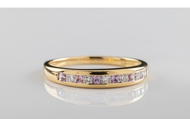 A pink sapphire and diamond ring The 18ct yellow gold ring c...