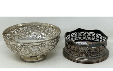 A silver coloured metal pierced bowl, and a silver plated bo...