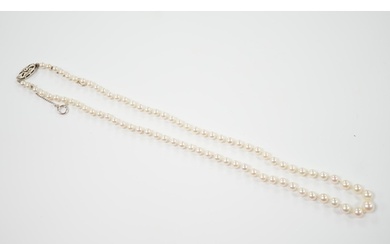 A single strand graduated cultured pearl necklace, with sing...