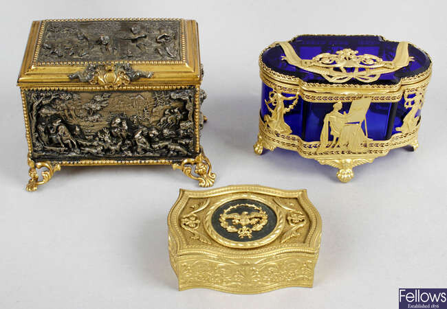 A small late 19th century gilt metal and bronzed casket, included with, a late 19th century Bristol Blue glass casket with hinged cover, a 19th century mother-of-pearl and abalone shell veneered visiting card case, etc.