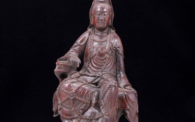 A solemn agarwood carved statue of Guanyin