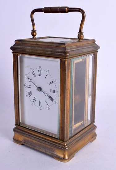 AN ANTIQUE FRENCH BRASS CARRIAGE CLOCK with roman