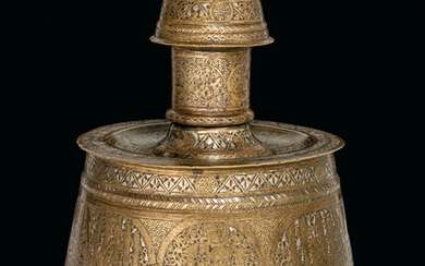 AN ARAB SILVER AND GOLD-INLAID BRASS CANDLESTICK, MOSUL, IRAQ, FIRST THIRD 14TH CENTURY