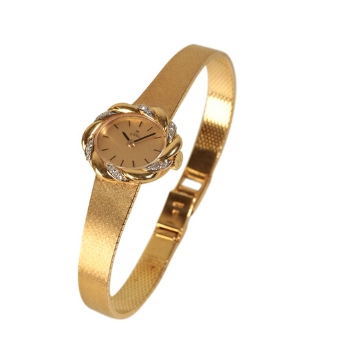 AN EBEL 18CT GOLD LADY'S BRACELET WATCH with manual wind mov...