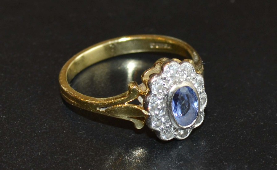 An 18 Carat Gold Tanzanite and Diamond Ring set with an oval...